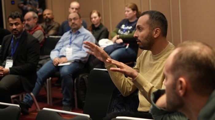 Audience member engages during maritime database presentation by Jann Wendt, CEO of north.io at SIGSPATIAL 2023