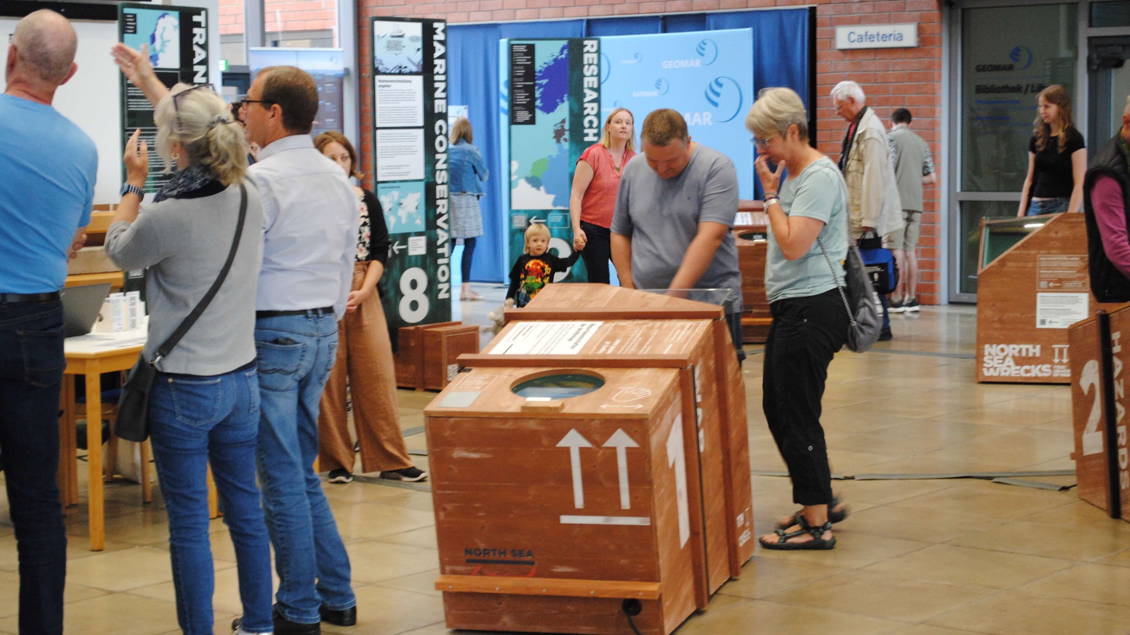 Visitors from the public engaged with the interactive exhibition.